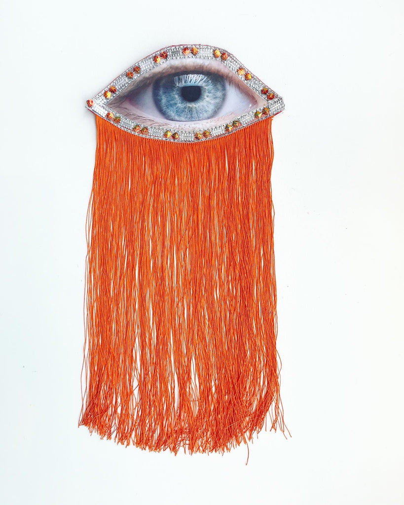 Eye Appliqué with Beaded Trim and Orange Fringe